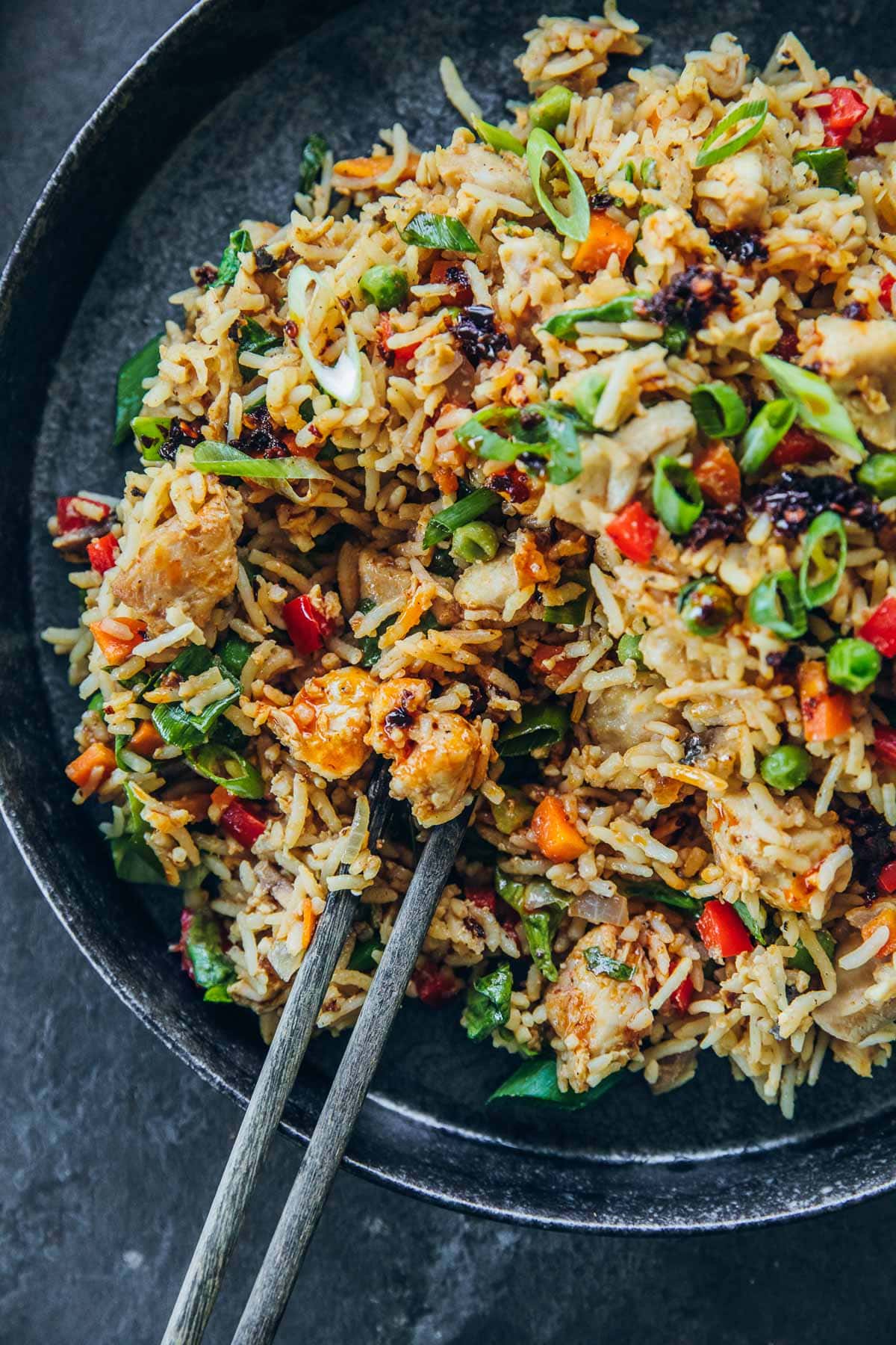 Chicken Fried Rice in a bowl with chopsticks.