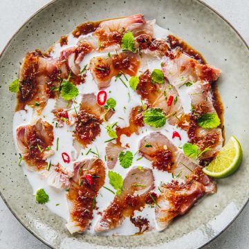 Kingfish Ceviche dressed with creamy coconut milk and a sweet, sour and spicy Thai dressing.