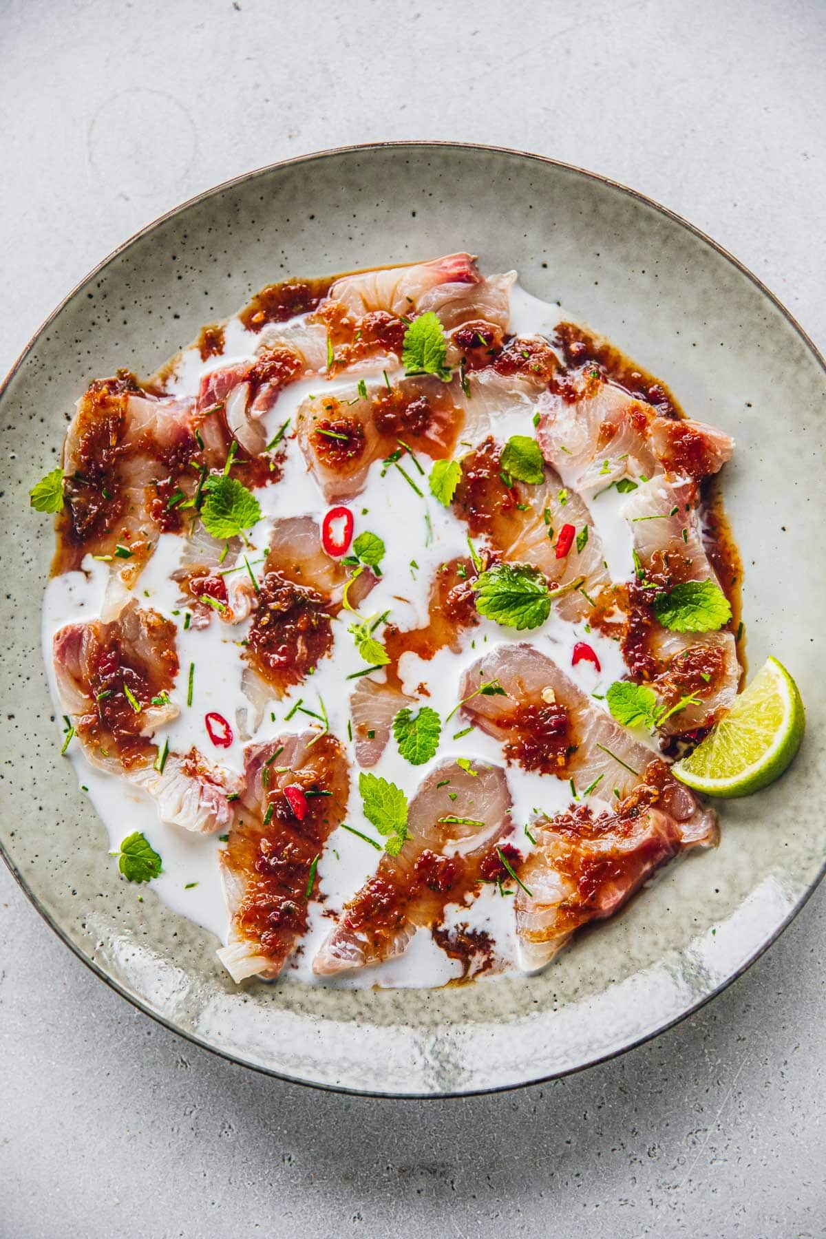 Kingfish Ceviche dressed with creamy coconut milk and a sweet, sour and spicy Thai dressing.